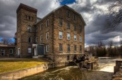McArthur Mills This five story stone structure in Carleton Place was built in 1871 by Archibald McArthur as a Woolen Mill. He manufactured fine worsteds and tweeds.